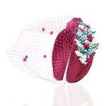 diadema-eda-de-flores-preservadas-para-invitadas-de-boda-en-color-turquesa-y-fucsia